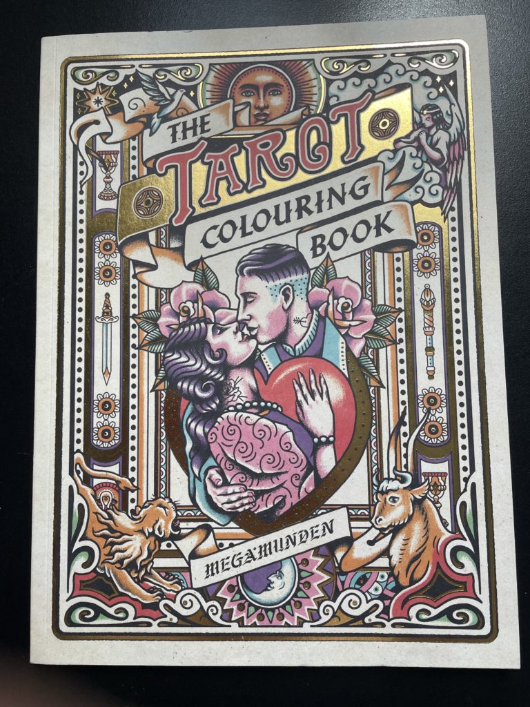 Tarot colouring book front cover with image of a couple kissing